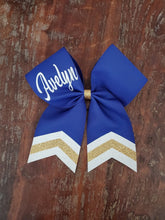 Load image into Gallery viewer, Royal blue hair bow with white and gold chevrons and custom name. 

